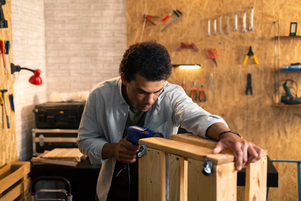 carpenter drilling wood